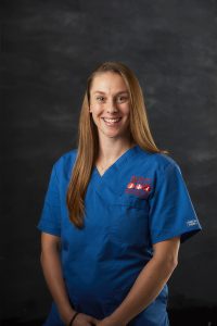 Smiling Portrait image of Vicky Higgins from nursing team wearing blue nurse suit